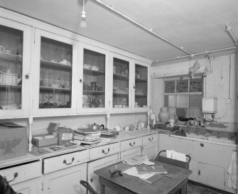 Interior, view of lower ground floor china pantry with original china cupboards