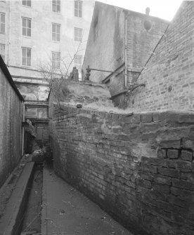 View from SW of alley between bolier house and engine room.