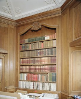 Interior. Octagonal library detail of panelling and bookcase