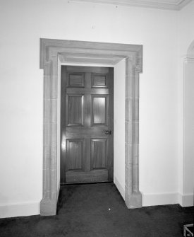 Interior. Ground floor Detail of entrance hallway door with stone roll moulded lugged architrave the original front door