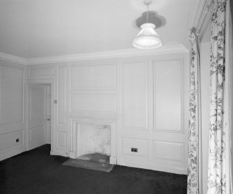 Interior. Ground floor View of Ante room in E wing from W showing 18th century fireplace and panelling