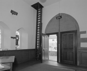 Interior, detail of entrance hall showing access into bell chamber, from S.