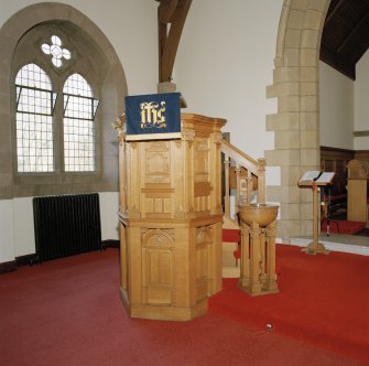 Interior, detail of pulpit and font.