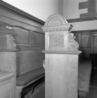 Interior, detail of choir stall in chancel.