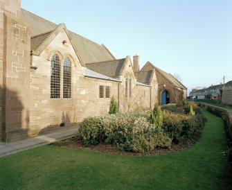 Exterior, general view along west elevation from N showing church hall.