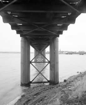 Detailed view from SW beneath the bridge, showing the under side of the deck, and the pairs of piers supporting each section of the bridge