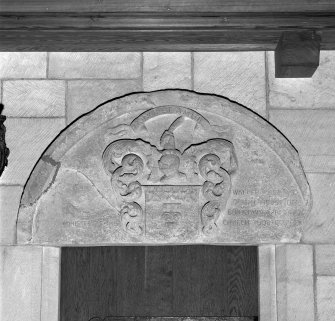 Interior. Chancel. Detail of 17th century carved tympanum above door at N