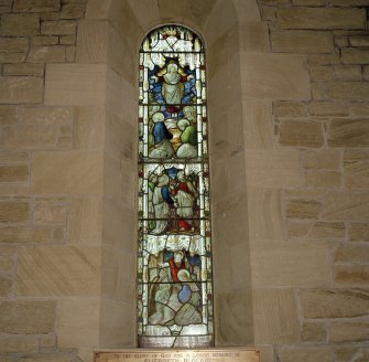 Interior. Detail of tall stained glass window to W gable