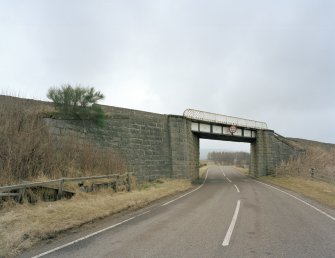 General view of railway bridge from NW, showing granite abutments and single steel truss