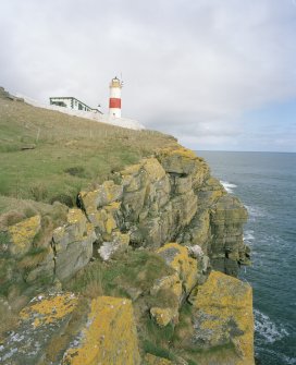 General view of lighthouse from cliffs to the S of the compound