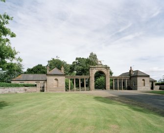 Lion gate, screen wall and cottages. View from WSW