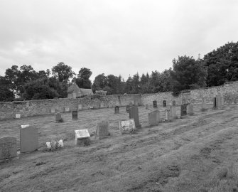 View of  graveyard in former manse walled garden from ENE