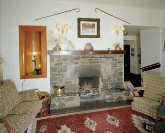 Interior.
Lounge, detail of c. 1970 fireplace with 1930's niche.  The 1930's fireplace was a larger version of the one in the private sitting room.
