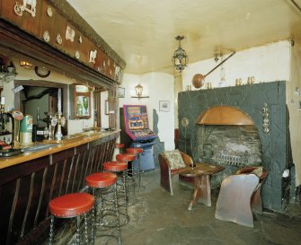 Interior.
Willie Wastle's bar, view from ESE showing fireplace and bar with original 1930's 'Swiss' furniture.