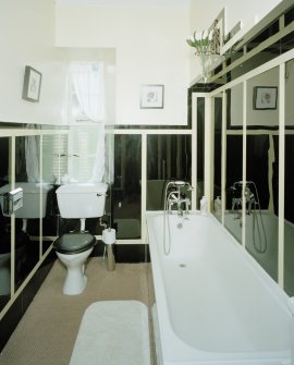 Interior.
First floor, S bathroom, view from W showing 'Vitrolite' panels.