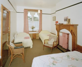 Interior. Ground floor View of "family" bedroom from E with original fireplace