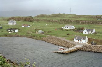 Muck, Port Mor and Pier Cottage. School, quay, cottage and gear store. View from WSW.