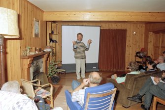 RCAHMS Muck Survey. Strat Halliday giving a talk on the work of RCAHMS in Port Mor House.