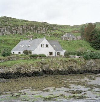 Muck, Port Mor. Port Mor House Hotel and building (NM 4208 7938) on terrace above. View from SE.