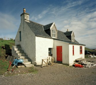 Muck, Port Mor, Pier Cottage. Cottage and gear store. View from NNW.