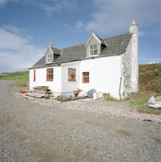 Muck, Port Mor, Pier Cottage. Cottage and gear store. View from SSW.