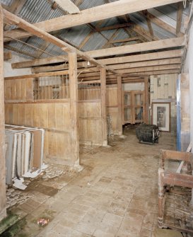 Interior. View of stables and roof structure