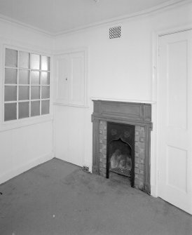 Interior, ground floor view of office showing original fireplace