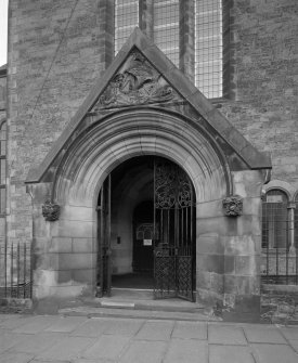 View of main North entrance porch showing gates and ship carving