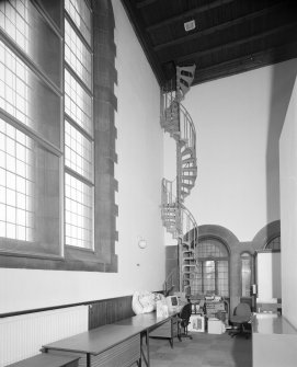 Interior, view of metal spiral staircase from original gallery to attics