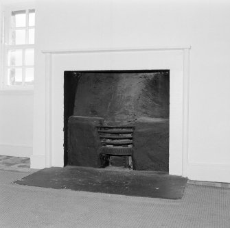 Interior. E Attic room Detail of fireplace