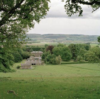 View from N showing house, stables and steading with views over the Tay to Fife.