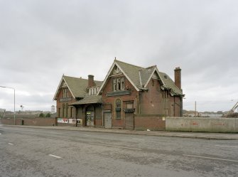 General view of station offices from NE, with Balmore Road in the foreground