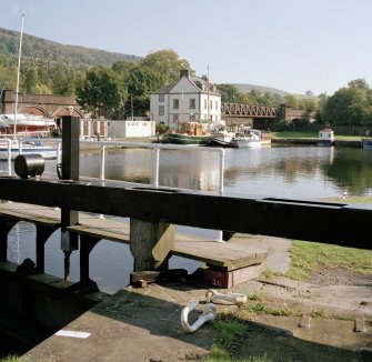 Basin and custom house with lock gates in foreground, view from west