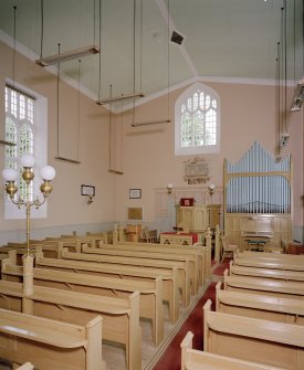 Interior.
View from SE showing pews, organ and communion table.