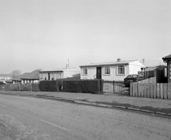 View from SW of one of several remaining prefabricated houses in Craigour Drive and Craigour Avenue.
'AIROH', prefabricated aluminium bungalow, Moredun area, Edinburgh (built 1949).