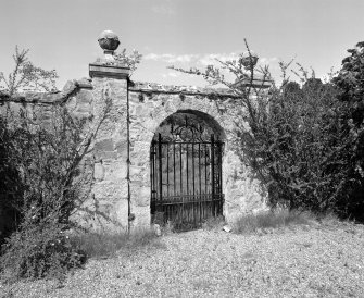 Formal Garden. Detail of walled garden; South gate with stone archway flanked by ball finialed pilasters