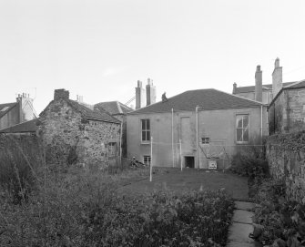 View from West North West showing garden frontage and wash house