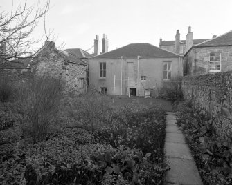 View from West North West showing garden frontage and wash house