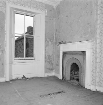 Interior. Ground floor. View of North corner room from South showing fireplace and window