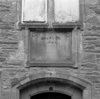 Detail of 1843 date plaque above entrance.