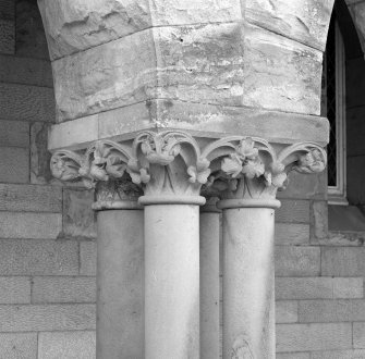 Detail of arcade column foliated capital.