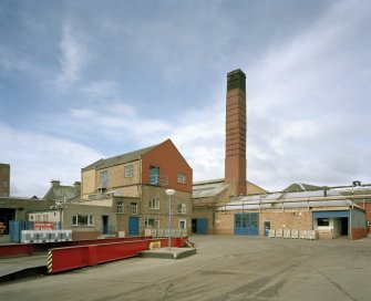 General view from SE across yard, showing boiler-house chimney, laboratory (centre left), and weighbridge (foreground left)