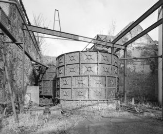 Detailed view from W of one of two surviving cast-iron washbacks from the former distillery, currently used as a water tank