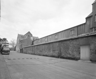 View from E along  S side of former floor maltings, built in 1857 and re-built in 1914