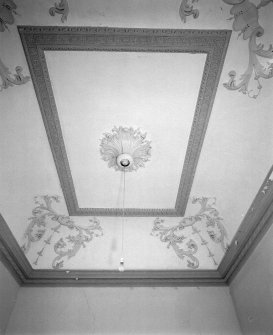 View of staircase hall plaster coved ceiling.