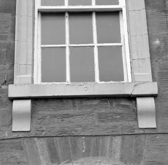 South frontage, detail of first floor carved window cill.