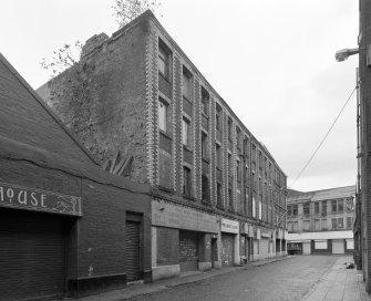 View from W along of the plainer block occupying 15-25 Gibson Street