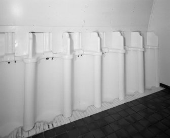 Interior. Detailed view in ground-floor toilets of urinals