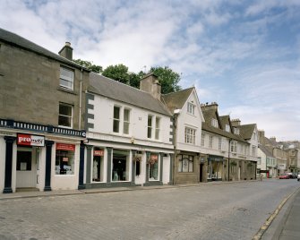 View from SW showing shopfront with cast iron corinthian columns