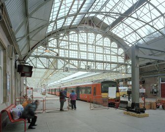 View of platforms from WNW, showing Strathclyde Passenger Transport Executive electric train (in old orange livery)
